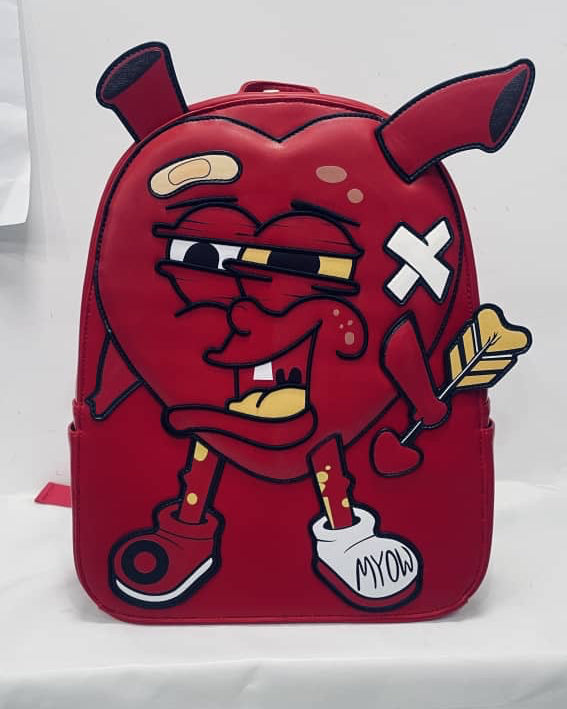 Red backpack with cartoon character design on a white background
